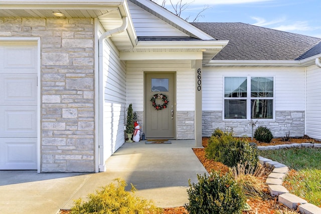 entrance to property featuring a garage