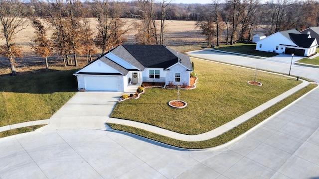 exterior space with a front yard and a garage