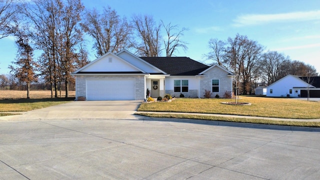 ranch-style house featuring a front yard and a garage