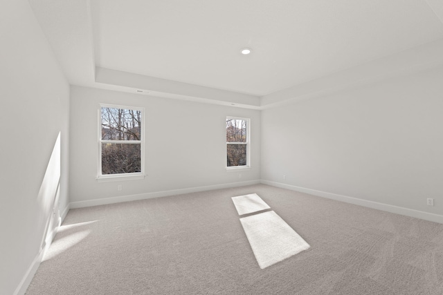 empty room featuring light colored carpet