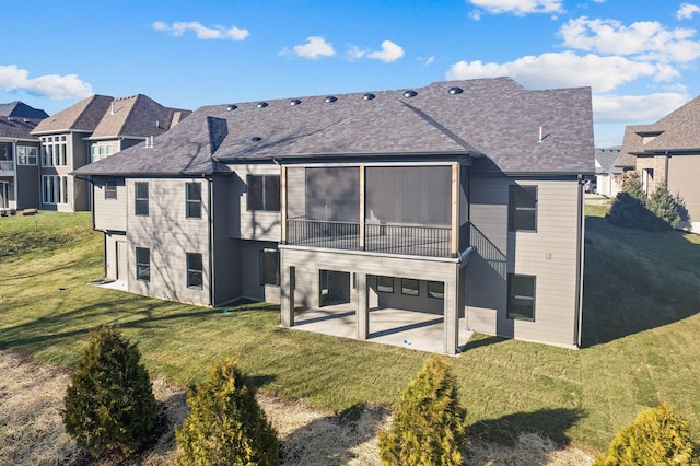 back of property featuring a patio area and a yard