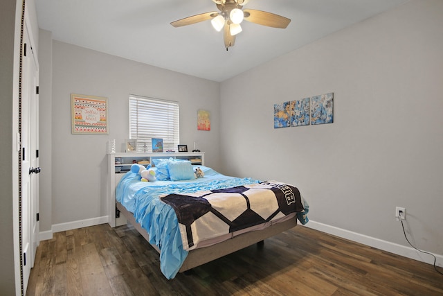 bedroom featuring ceiling fan and dark hardwood / wood-style floors