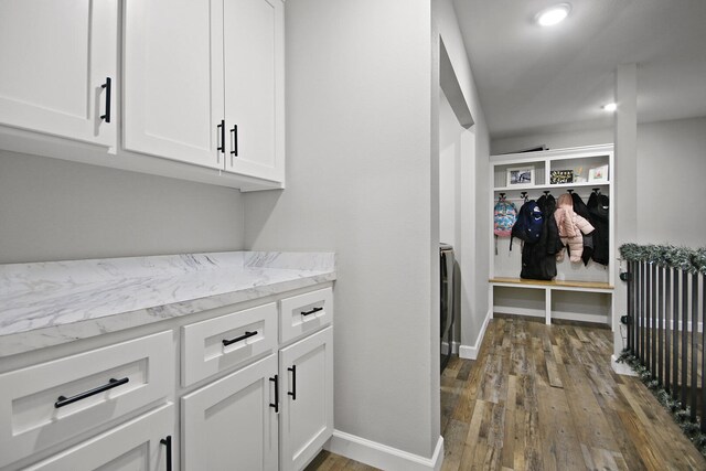 laundry area featuring dark hardwood / wood-style flooring