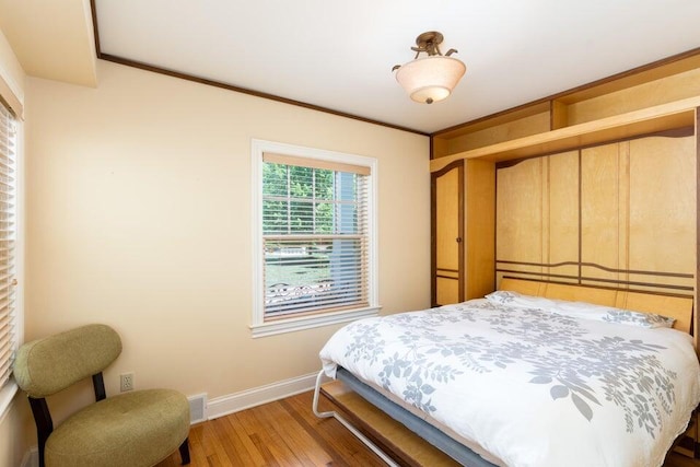 513 Rockhill Rd, Columbia, MO 65201 - bedroom featuring wood finished floors and crown molding