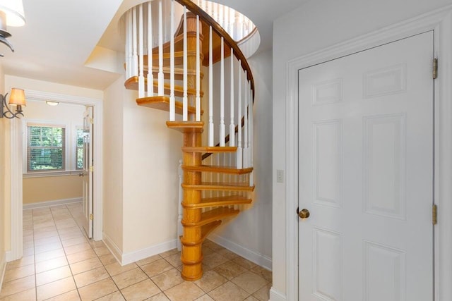 513 Rockhill Rd, Columbia, MO 65201 - staircase with tile patterned flooring and baseboards