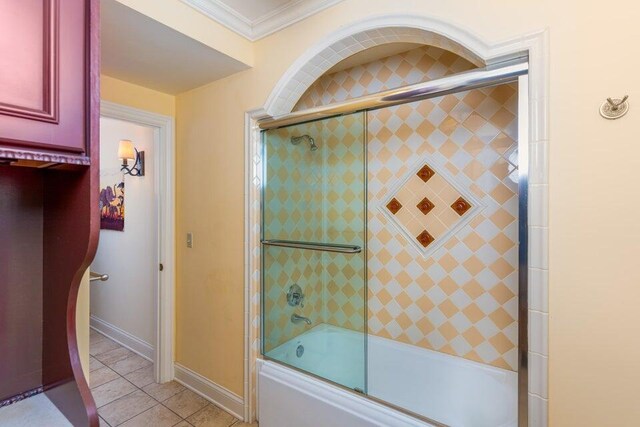 513 Rockhill Rd, Columbia, MO 65201 - full bathroom featuring ornamental molding, combined bath / shower with glass door, and tile patterned flooring