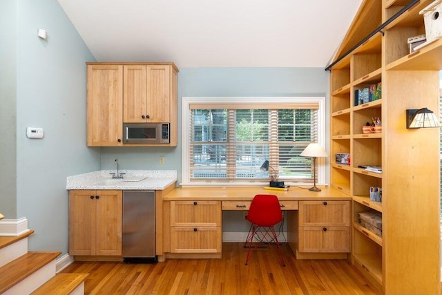 513 Rockhill Rd, Columbia, MO 65201 - kitchen with stainless steel microwave, open shelves, light wood-style floors, fridge, and light brown cabinetry
