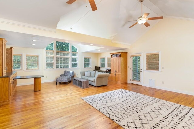 living room featuring light hardwood / wood-style floors, high vaulted ceiling, and ceiling fan