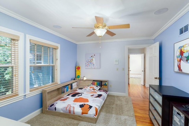 bedroom featuring ceiling fan, light hardwood / wood-style floors, and ornamental molding