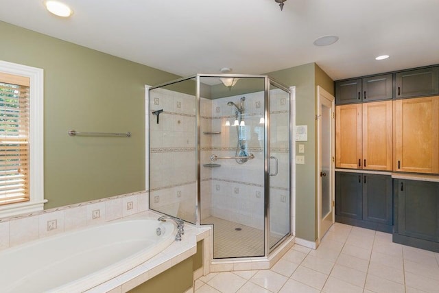 513 Rockhill Rd, Columbia, MO 65201 - full bath with a garden tub, tile patterned flooring, a shower stall, and recessed lighting