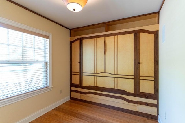 513 Rockhill Rd, Columbia, MO 65201 - unfurnished bedroom featuring wood finished floors and a closet