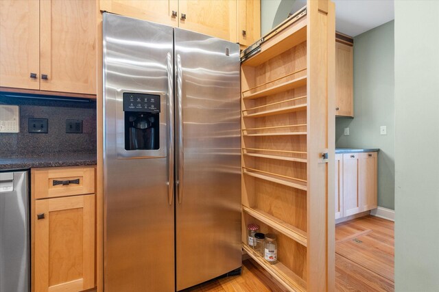 513 Rockhill Rd, Columbia, MO 65201 - kitchen with appliances with stainless steel finishes, light wood-type flooring, light brown cabinetry, and tasteful backsplash