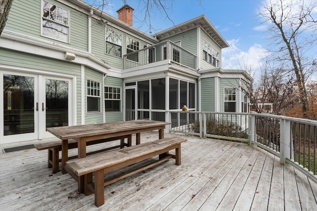 deck with a sunroom