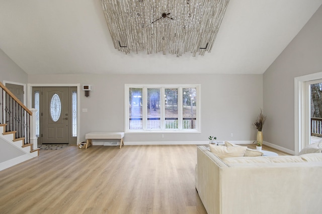 unfurnished living room with hardwood / wood-style flooring and lofted ceiling