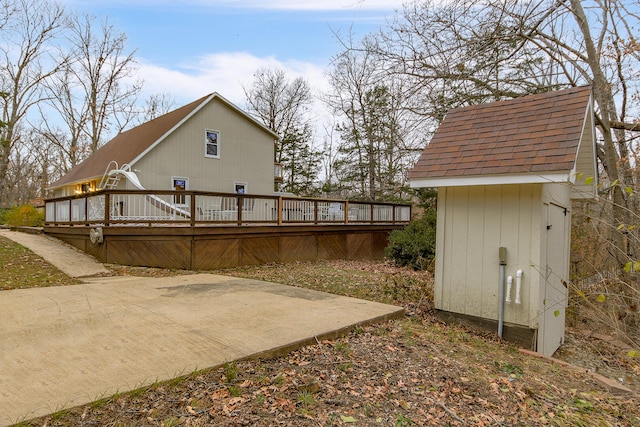 rear view of house featuring a deck