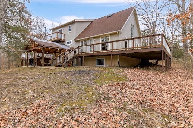 rear view of property with a wooden deck