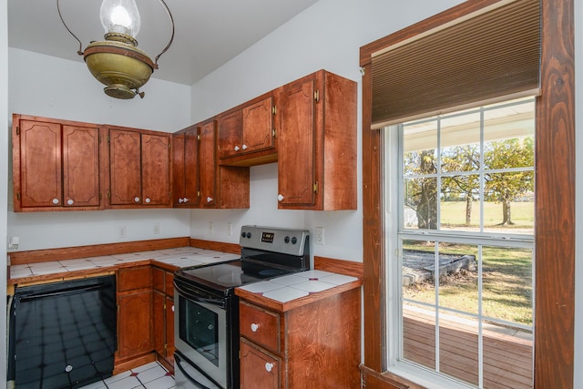 kitchen with tile countertops and stainless steel electric range