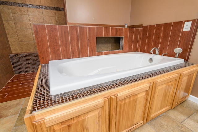 bathroom featuring a washtub