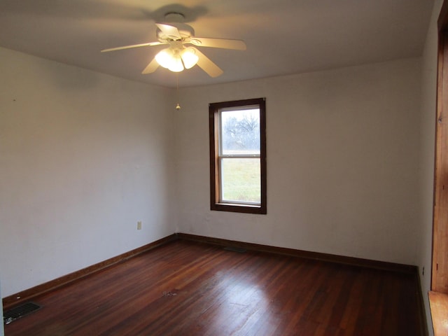 unfurnished room featuring dark hardwood / wood-style flooring and ceiling fan