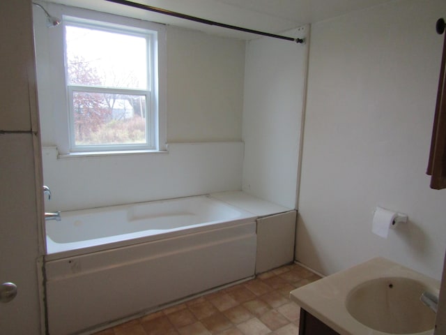 bathroom featuring a bathing tub and vanity