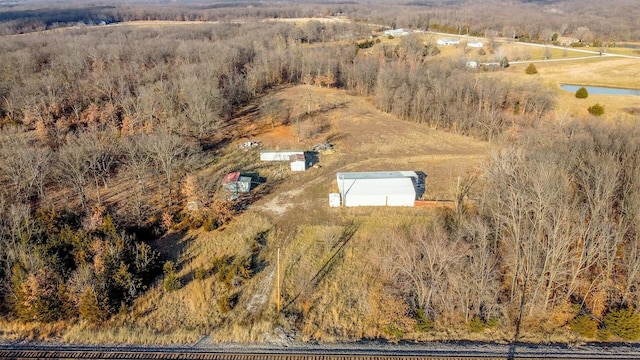 birds eye view of property with a rural view