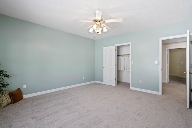 unfurnished bedroom featuring a ceiling fan, carpet, and baseboards