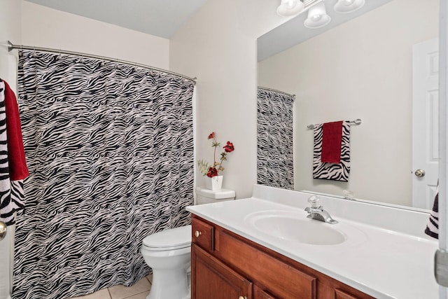 full bathroom with vanity, toilet, and tile patterned floors