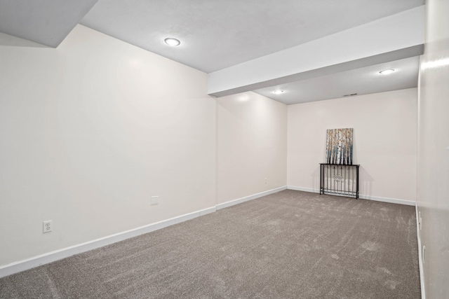 below grade area featuring carpet floors, baseboards, and recessed lighting