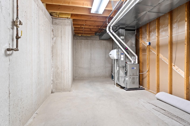 unfinished basement featuring heating unit