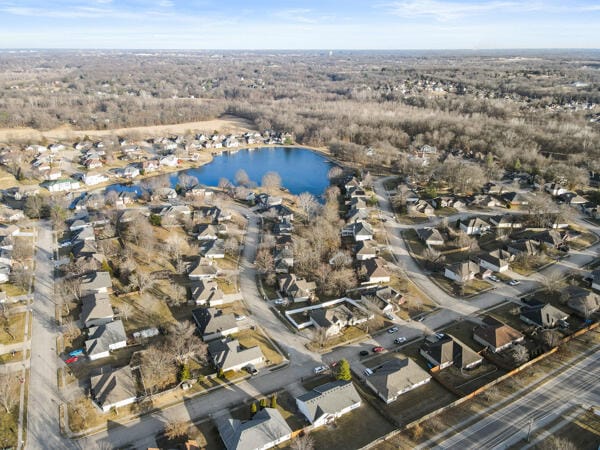 bird's eye view featuring a water view and a residential view