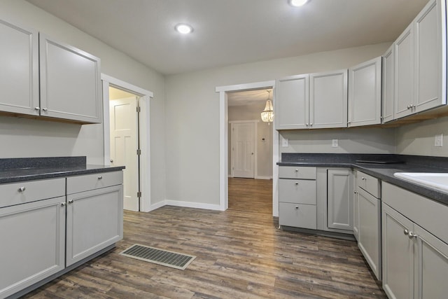 kitchen featuring dark hardwood / wood-style flooring and sink