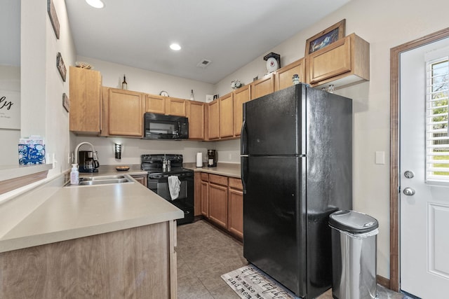 kitchen featuring sink and black appliances