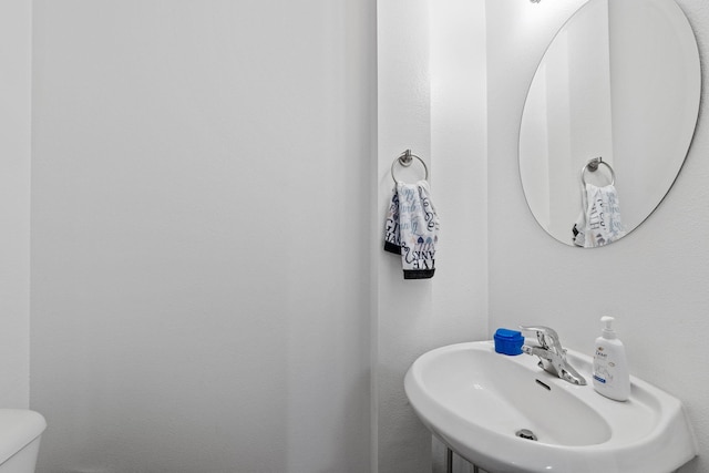 bathroom with toilet and sink