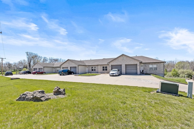 ranch-style home with a garage and a front lawn