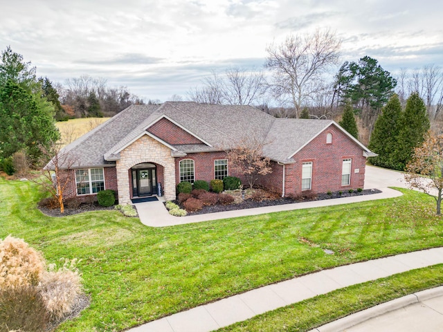 ranch-style home featuring a front yard