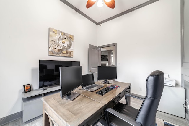 office area featuring ceiling fan, light wood-type flooring, and ornamental molding