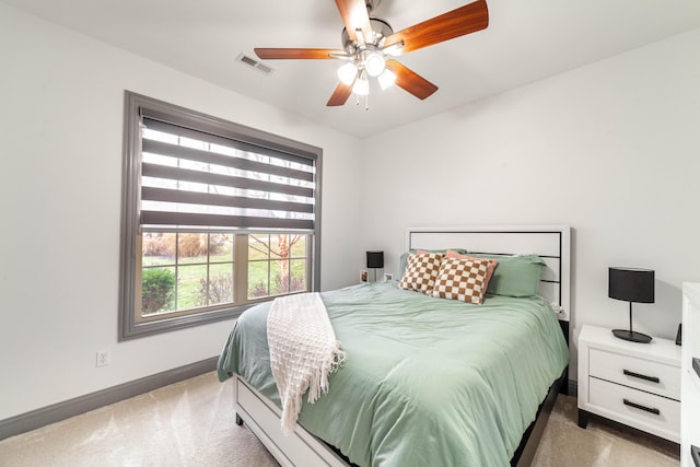 bedroom with dark colored carpet and ceiling fan