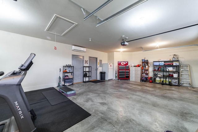 garage featuring a wall unit AC, white fridge, and a garage door opener