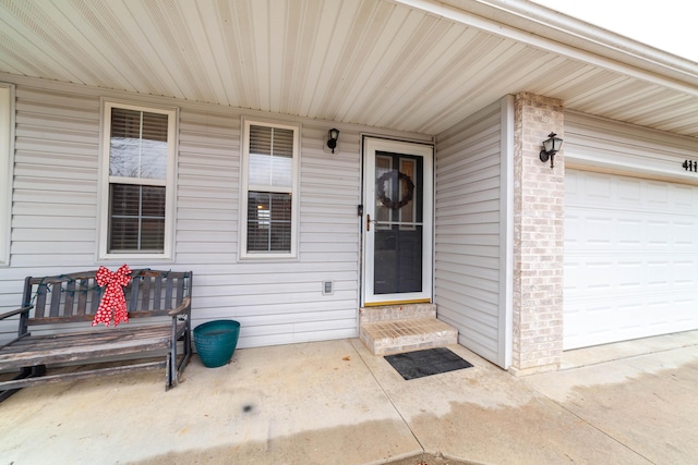 entrance to property featuring a garage