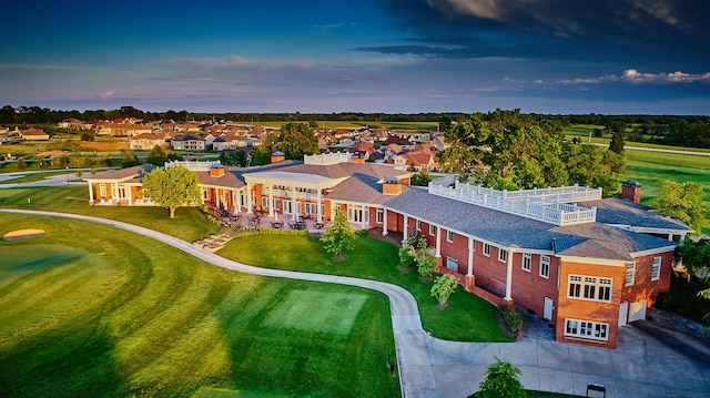 aerial view at dusk featuring a residential view