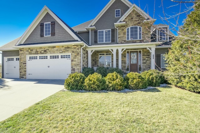 craftsman inspired home with stone siding, a porch, concrete driveway, and a front yard