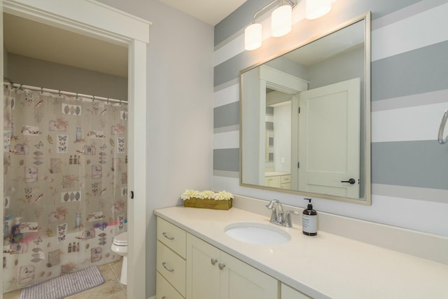 full bath featuring a shower with shower curtain, vanity, toilet, and tile patterned floors