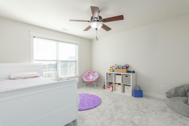 bedroom featuring carpet floors, ceiling fan, visible vents, and baseboards