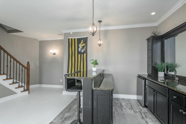 dining room featuring light wood finished floors, baseboards, stairway, crown molding, and recessed lighting