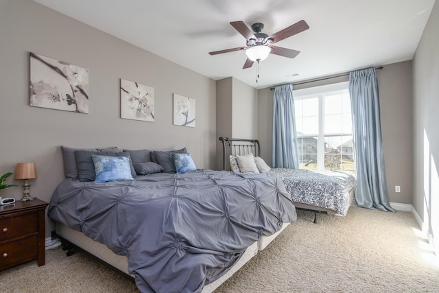 bedroom featuring carpet flooring, a ceiling fan, and baseboards