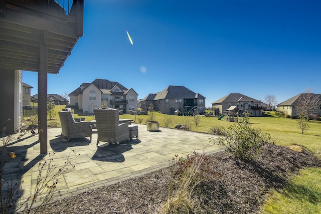 view of patio featuring a residential view and a playground