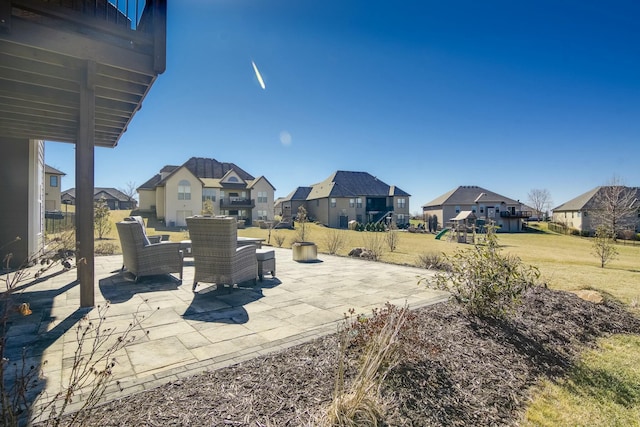 view of patio / terrace with a playground and a residential view