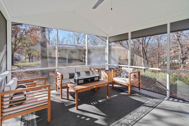 sunroom featuring ceiling fan and vaulted ceiling