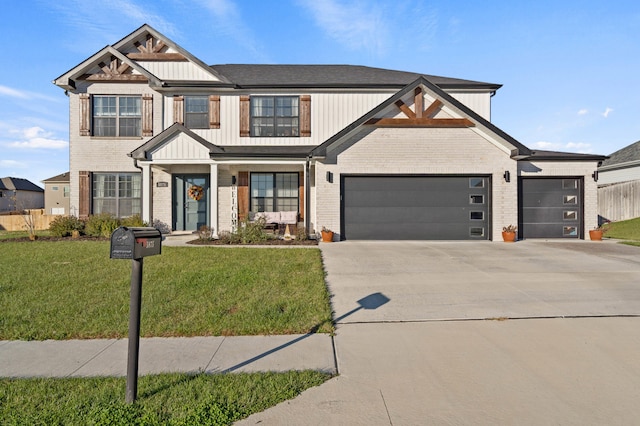 view of front of property featuring a front yard and a garage