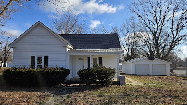 view of front facade featuring an outdoor structure and a garage